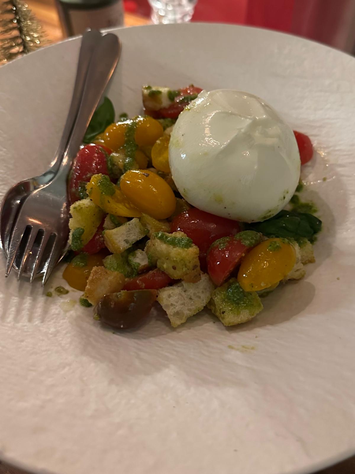 Burrata with pistachio and tomato's at Osteria Bella Ciao