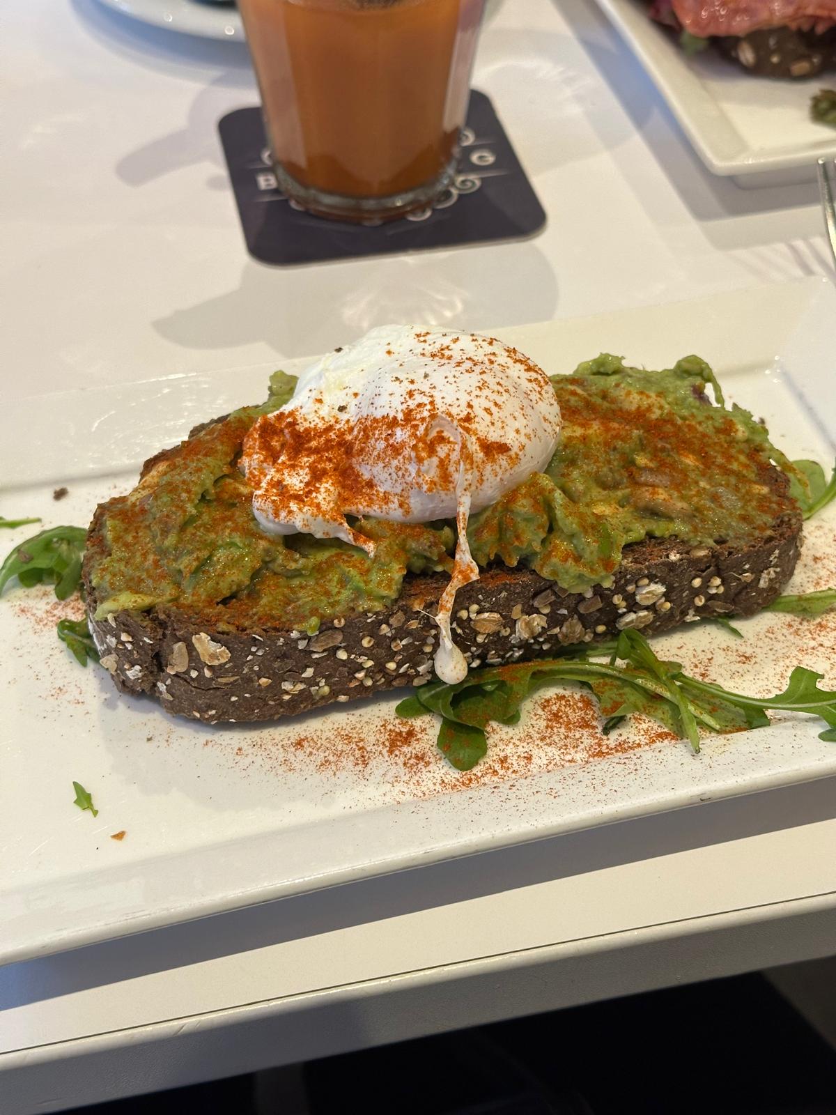 Avocado toast with poached eggs at Blushing Amsterdam